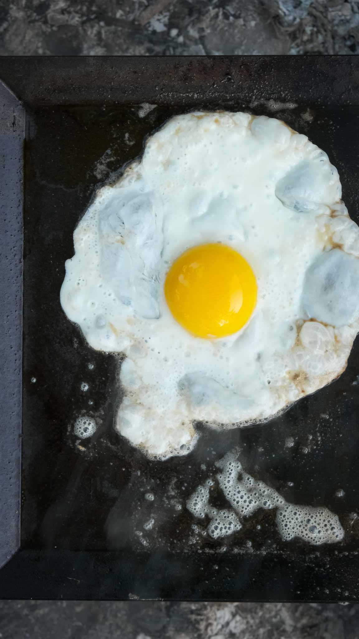 fried egg with fiddleheads